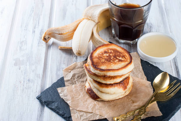 Stack of  pancakes in a dish on wooden white  background