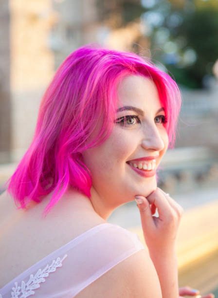 istock Beautiful young woman in pink 691630596