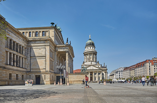 Berlin, Germany - May 12, 2017: French Cathedral and Gendarmenmarkt Square on May 12, 2017 in Berlin, Germany. The square was created by Johann Arnold Nering at the end of the seventeenth century.