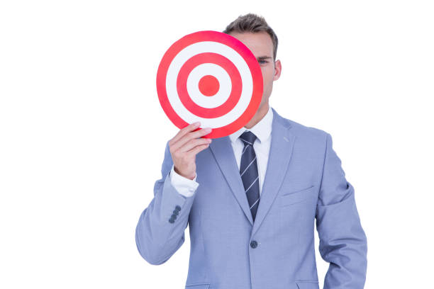 istock Handsome businessman holding target 691639586