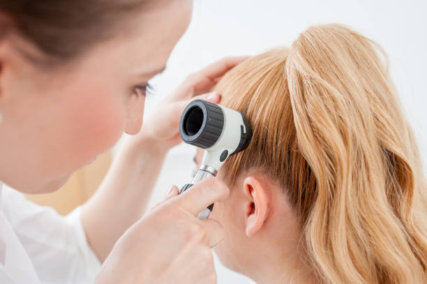 istock Female Doctor performing a Trichoscopy 691648526