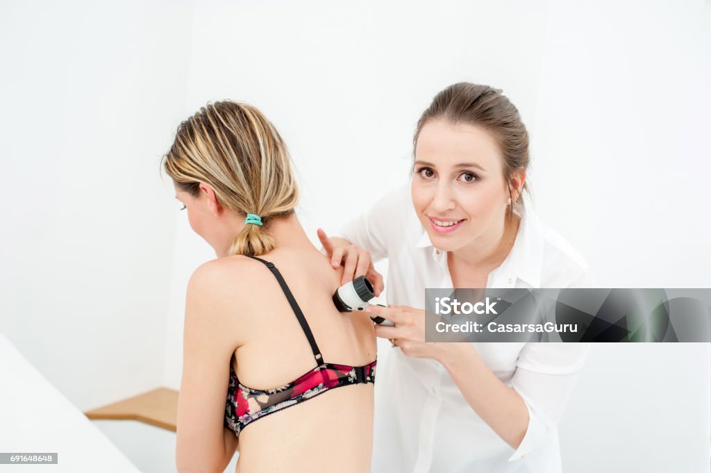 Dermatologist Inspecting Patient Skin Moles Dermatologist Stock Photo