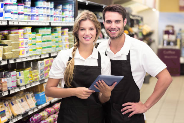 istock Portrait of smiling colleagues using a digital tablet 691652032