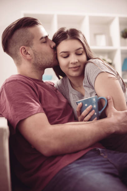 istock Young couple in living room 691655476