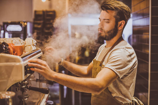istock Young barista is making a coffee in cafe shop 691658634