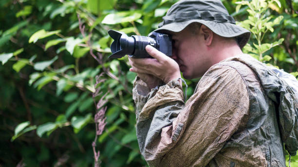 istock Camouflaged photographer 691661860