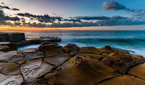 istock Rocky Sunrise Seascape 691673042