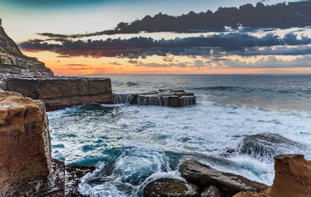 istock Rocky Sunrise Seascape 691673052