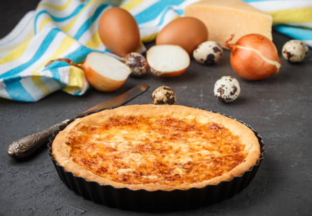 istock Homemade gourmet pie with cheese, onions and eggs. Selective focus 691678494