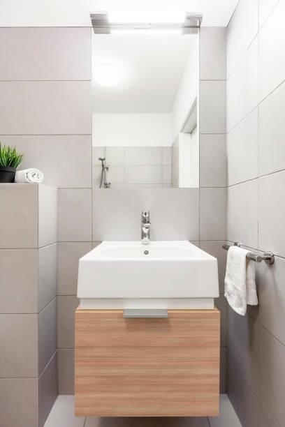 istock Beige bathroom with countertop basin 691683562