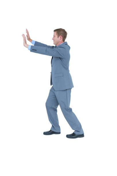 istock Businessman standing and pushing with hands 691685130