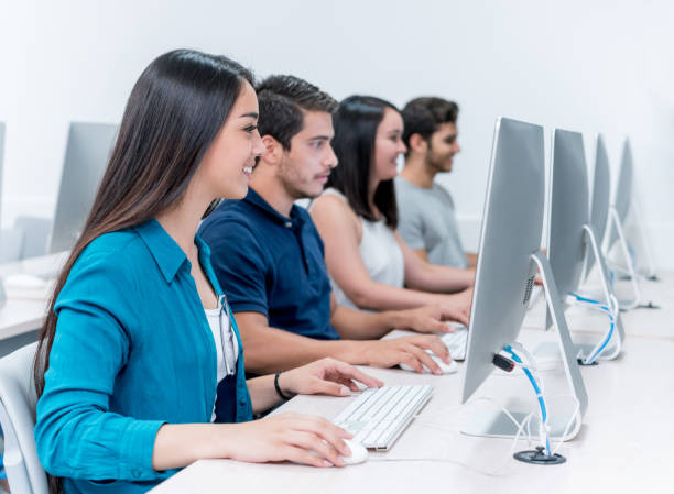 istock Happy group of IT students in class at the university 691693204