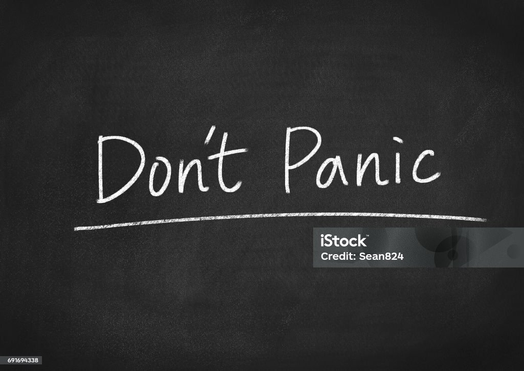 don't panic don't panic words on a chalkboard background Terrified Stock Photo