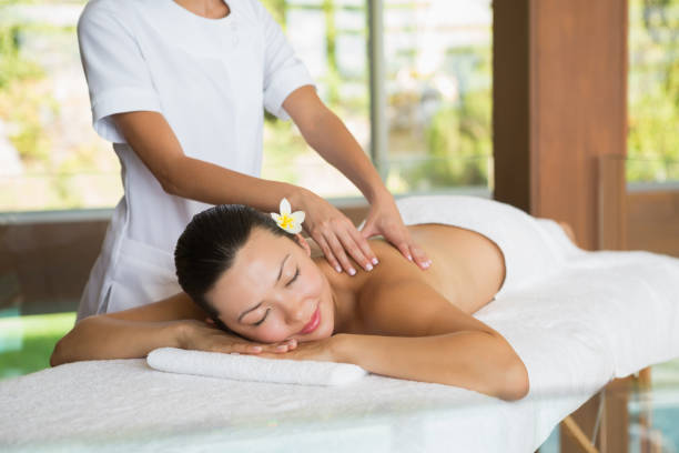 istock Brunette enjoying a peaceful massage 691697220