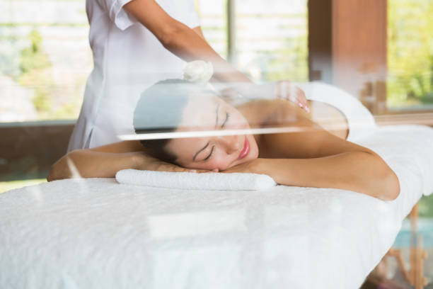 istock Brunette enjoying a peaceful massage with eyes closed 691697338