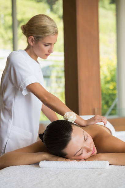 istock Brunette enjoying a peaceful massage with eyes closed 691697392