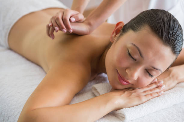 istock Brunette enjoying a peaceful massage with eyes closed 691697400