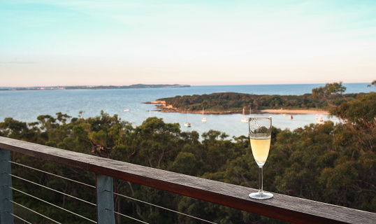 A shot of sparking wine on the balcony showing the horizon