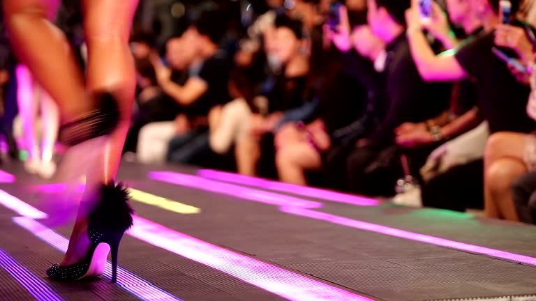 Fashion Show on LED floor which has Super Model present Shoes high heels