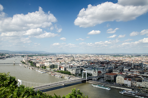 Danude River and Pest side of Budapest seen from stairs of Citadel during summer day
