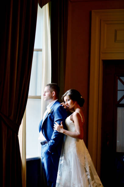 istock Wedding couple indoors is hugging each other 691701682