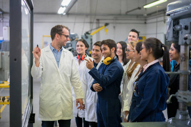 istock Teacher giving a class to a group of engineering students 691703558