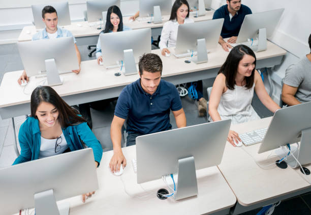 istock Group of students in a IT class at the school 691703612
