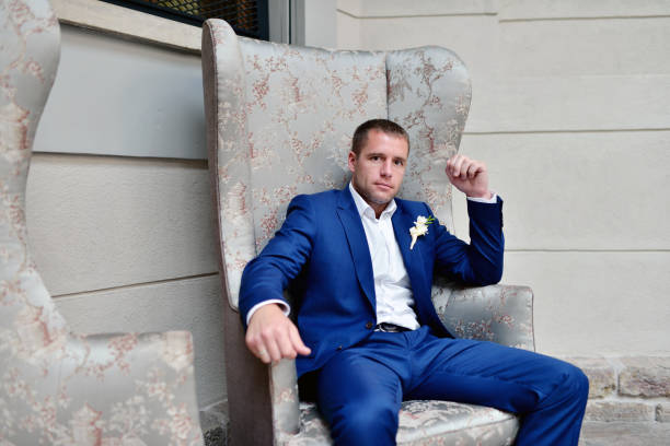 istock Handsome groom in suit in the hall 691706326