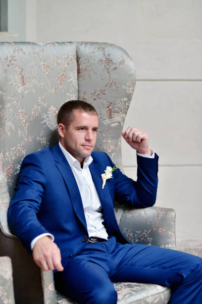istock Handsome groom in suit in the hall 691706462
