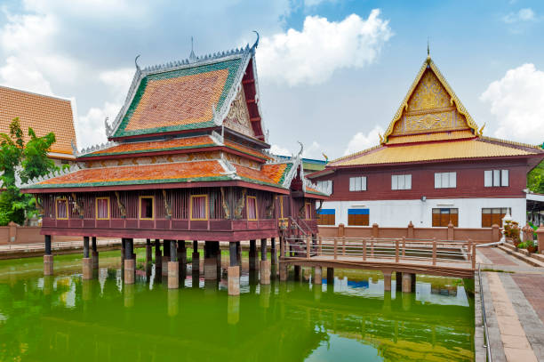 istock Ho Trai - Traditional Thai-style building used as a library that houses Buddhist scriptures (Tripitaka or Pali Canon) located at Wat Mahathat Temple in downtown Yasothon, northeastern (Isan) province of Thailand 691706902