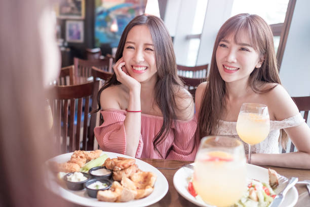 istock women dine in restaurant 691710892