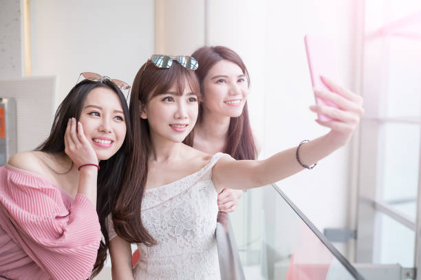 istock women selfie in mall 691715382