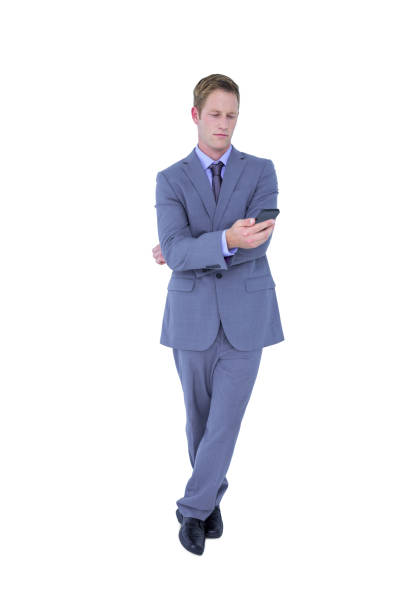 istock Handsome businessman texting on phone 691715408