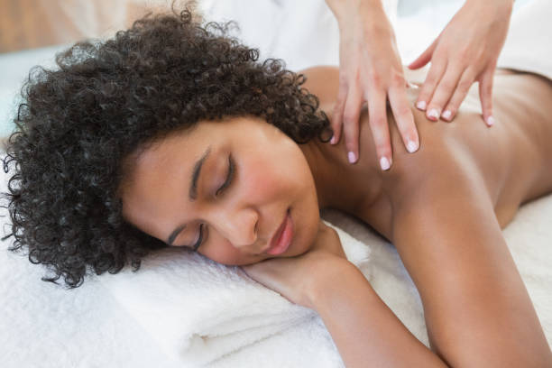 istock Gorgeous woman enjoying a shoulder massage 691716036
