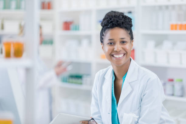 istock Portrait of happy pharmacist at work 691716134