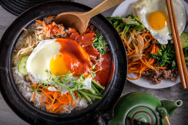 Healthy bi bim bap with egg and hot sauce