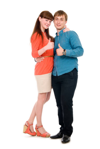 istock Young love couple showing thumbs up 691722478