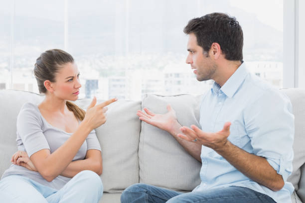 istock Couple having a serious argument on the couch 691730020
