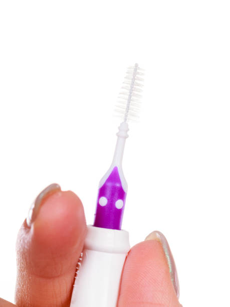 istock Woman holding toothbrush special for braces 691730120
