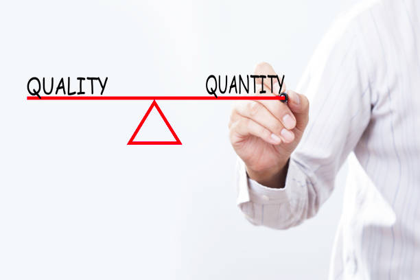 istock Businessman hand drawing Quality and Quantity balance - Business concept. 691738278