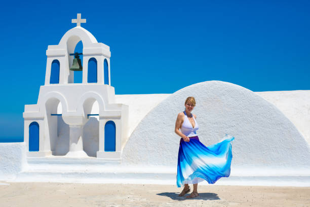 istock Woman dancing in Santorini island, Greece 691740498