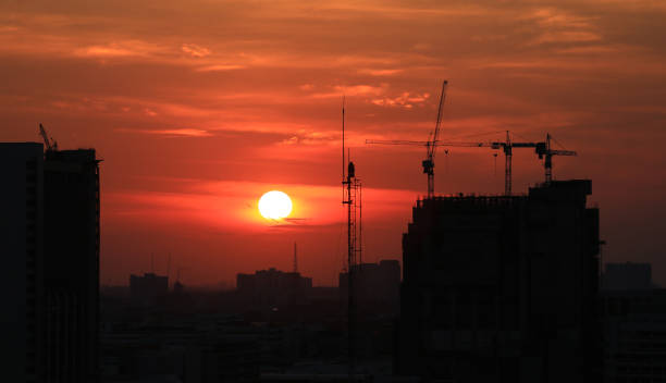 istock Sunset and clouds background in the evening, city downtown with sunset sky. 691741068