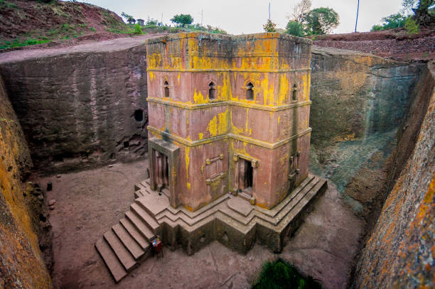 Stone Church No People The famous stone Church of Saint George with yellow moss and no people, Lalibela, Ethiopia, African Horn ethiopian orthodox church stock pictures, royalty-free photos & images