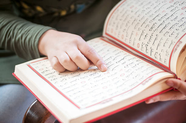 istock Young woman reading the Holy Qur'an 691743670