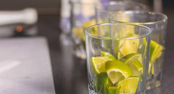 istock Lime cut in glasses with sugar to make caipirinhas 691744982