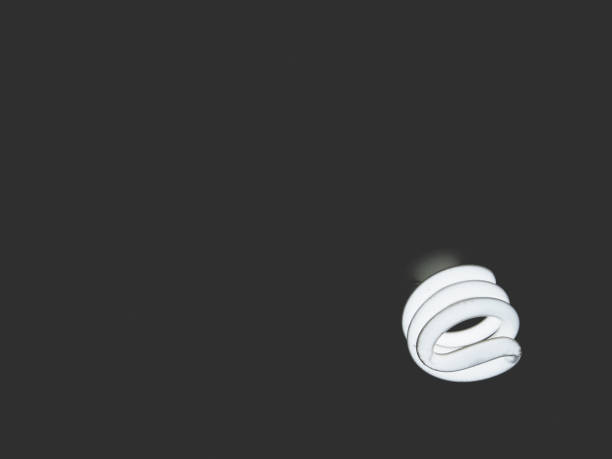 istock This is fluorescent lamp on black background, soft tone 691754012