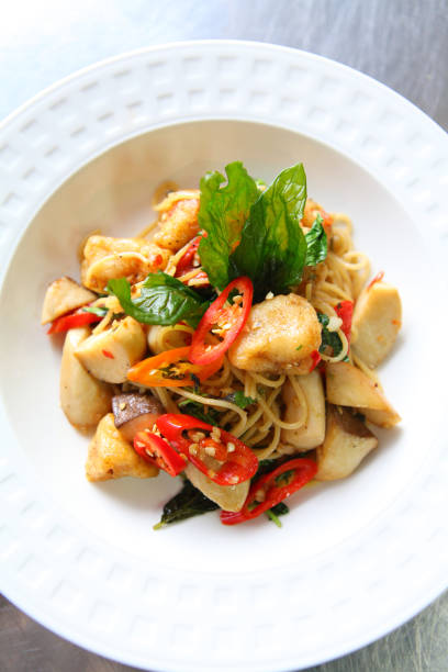 istock Close Up of Thai Spicy Spaghetti with basil 691754234