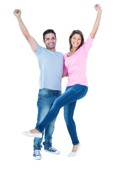 istock Happy couple smiling at camera and embracing 691755468