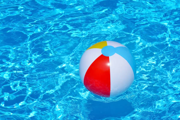istock Colorful inflatable ball floating in swimming pool 691757760