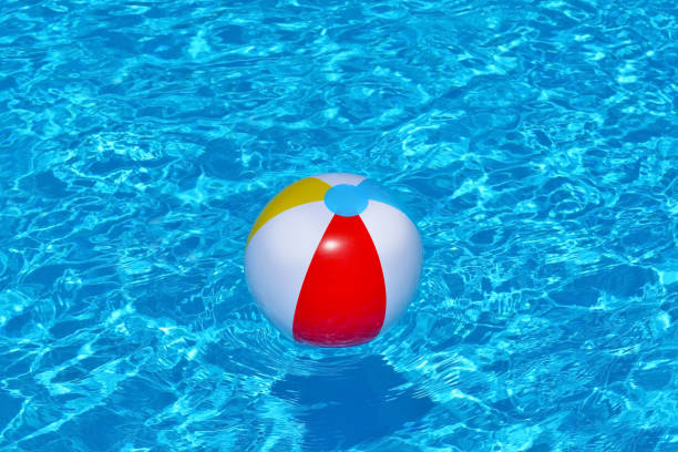 istock Colorful inflatable ball floating in swimming pool 691757860
